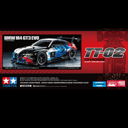 Tamiya BMW M4 GT3 EVO TT-02 radio control 4WD high performance racing car model kit box front cover, featuring a blue, white, and red livery race car on a red and black background with Tamiya and Toyashift branding. Tamiya BMW M4 GT3 EVO TT-02 1:10 4WD R/C racing car model kit