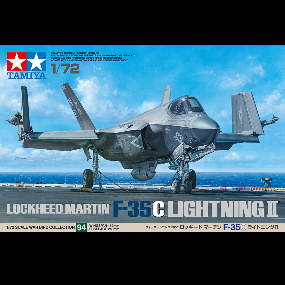 Tamiya F-35C Lightning II – 1/72 Scale Modern U.S. Carrier-Based Stealth Fighter. Model kit of a Lockheed Martin F-35 C Lightning II on an aircraft carrier with Tamiya branding.