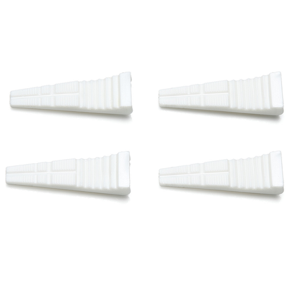 Tamiya Non-Scratch Replacement Jaw Grips. Four white rectangular objects on a white background