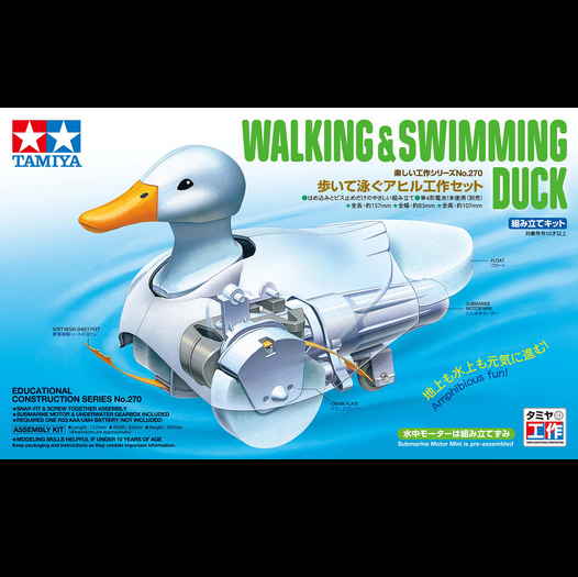 Tamiya Walking & Swimming Duck educational construction model box art, showing a cutaway white duck with exposed mechanical parts and Japanese text on a light blue background. Tamiya Walking and Swimming Duck mechanical assembly kit
