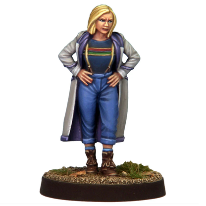 Temporal Traveller 13 by Crooked Dice. 28mm female time traveller miniature with bob haircut, long coat pulled back, jeans with braces and boots, standing hands on hips, ready for action.