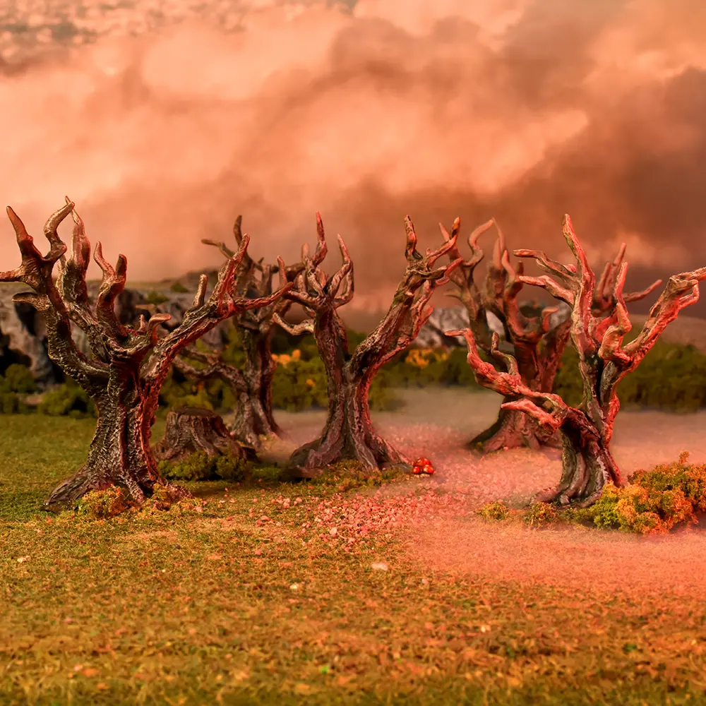 Dried trees with twisted branches against a pink sky. Terrain Crate Fantasy Forest Trees Scenery Set 28mm Terrain Crate Terrain