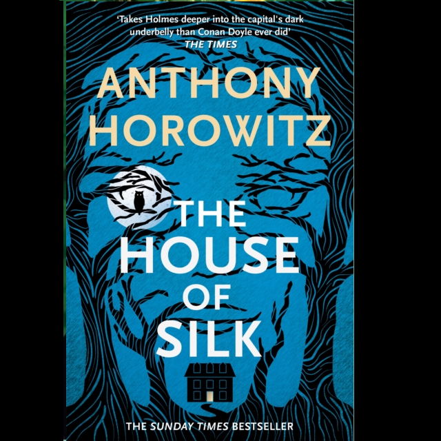 The House of Silk paperback novel by Anthony Horowitz. A blue background with stylised black trees, a small house and owl in front of the moon sat in the tree  