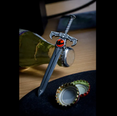 A miniature silver sword with a ...