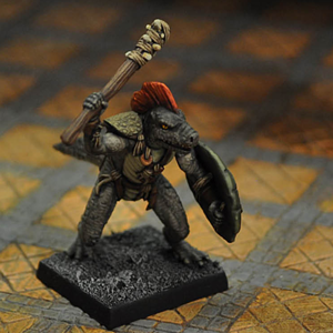 Troglodytes Chieftain by Crooked Dice. A multi part metal miniature representing a lizard men with primitive shield and club making a great edition to your RPGs and tabletop gaming