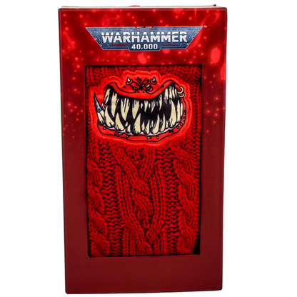 Warhammer Red Squig Slipper Socks with sherpa lining and non-slip sole, featuring appliqued squig design. One size.