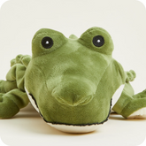 Green plush toy frog on a light ...