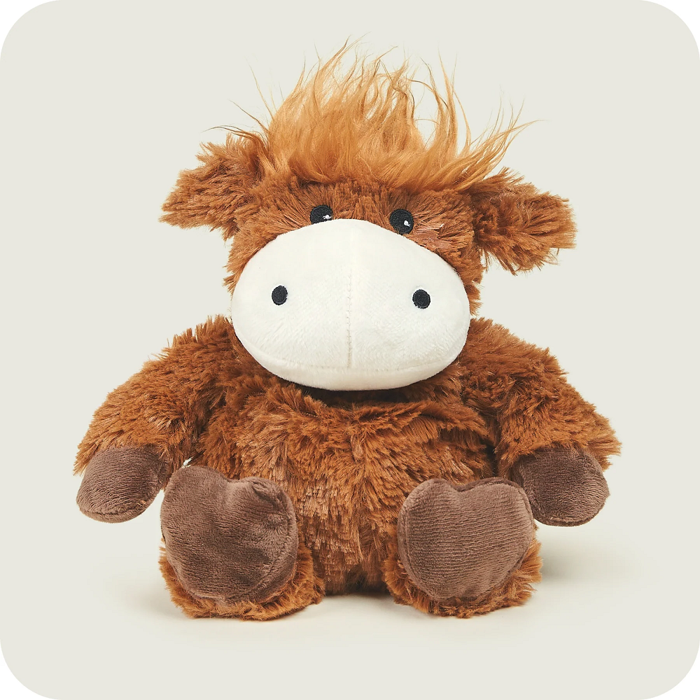 Warmies Highland Cow microwavable plush toy, lavender-scented and weighted, offering warmth, comfort, and relaxation for children and adults.