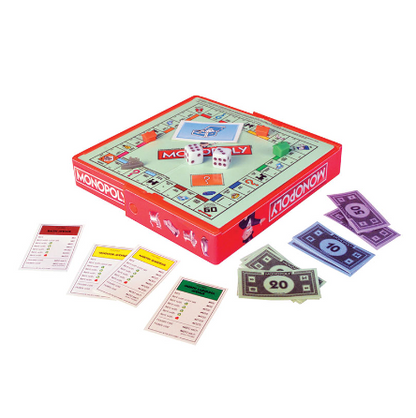 A classic Monopoly board game set displayed on a clean white background, featuring the red and green board box with playing cards, money, and dice arranged around it. World's Smallest Monopoly miniature board game