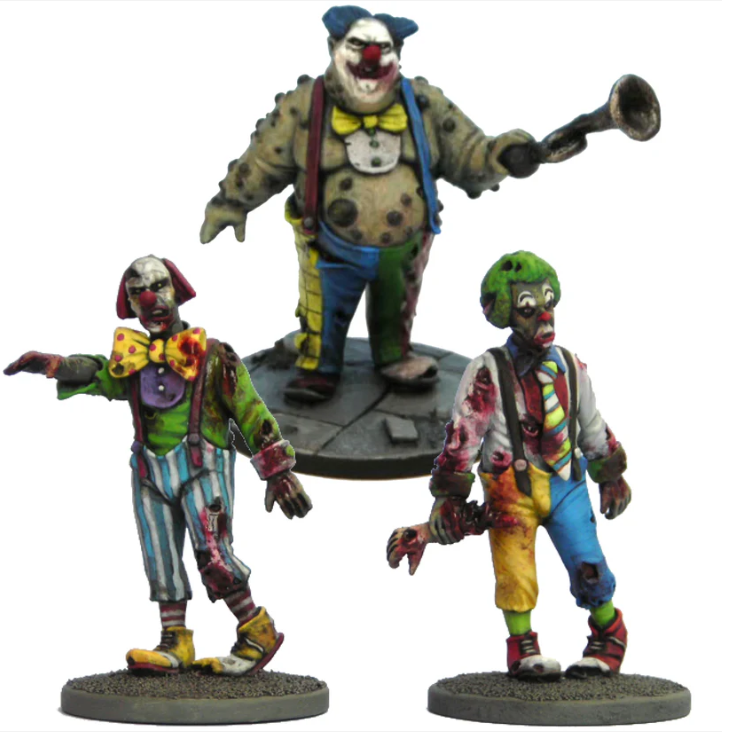 Zombie Clowns by Crooked Dice, a pack of three white metal 28mm scale miniatures for your tabletop games representing undead clowns, shambling across your tabletop with one even holding a severed arm