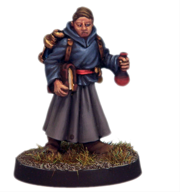 crooked dice Apprentice Magic User. Miniature figurine of a character in a grey robe holding a red object on a white background