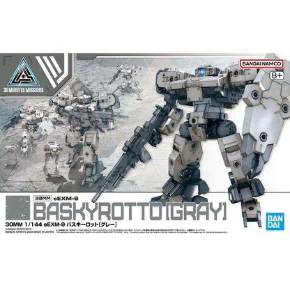 A 1/144 scale Gundam plastic model kit in grey, featuring an expandable backpack, rifle, shield with joints, and a RoiRoi drone unit for enhanced playability.