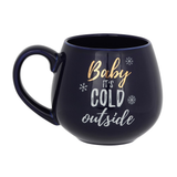 A beautiful rich blue rounded mug with gold and white writing saying 'Baby It's Cold Outside'.