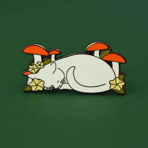 Cat In Nature enamel pin badge with two butterfly clutch fastenings. A white cat asleep amongst the flowers and toadstools for your clothing, bag, hat