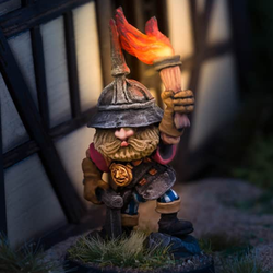 Squire Knapsack from Northumbrian Tin Solider range of Nightfolk. This metal miniature depicts a very characterful moustache and bearded squire with a lit torch up high guiding the way and a full rucksack on his back ready for an adventure on your gaming table.