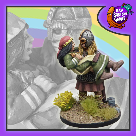 Bad Squiddo Games metal gaming miniature. shieldmaiden rescuing a villager by carrying her in her arms