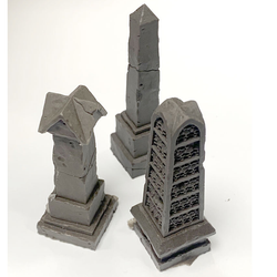 Graveyard Pillar Set by Legend Games is a set of three pillars with various details, one of which is adorned with skulls