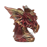 A red and gold dragon head with green eyes incense burner 