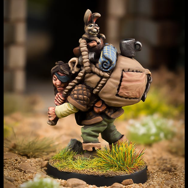 Alfie Beetle And Bun Bun by Northumbrian Tin Solider a lovely miniature of an over encumbered adventurer with a heavy sack that even contains a bunny companion and a cup precariously balanced on the top. 