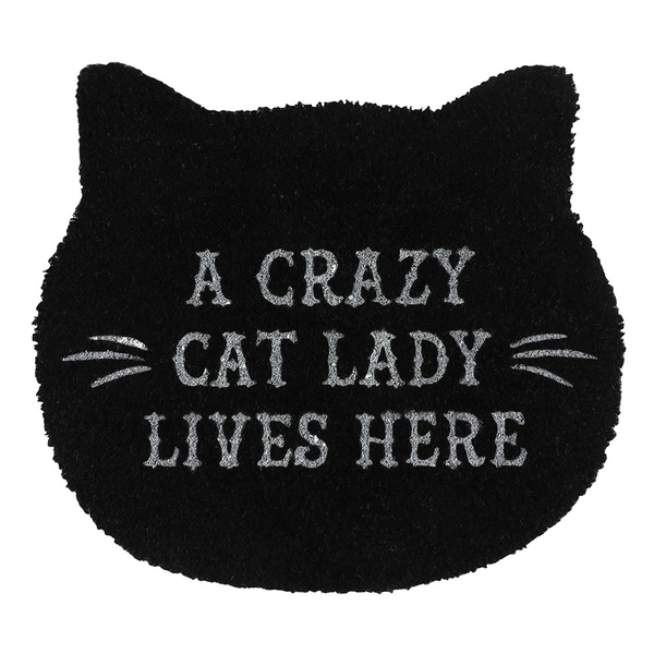this black cat head shaped doormat has the words A crazy cat lady lives here in white and a pair of white whiskers printed