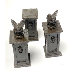 Graveyard Gargoyle Pillars by Legend Games is a set of three detailed pillars two of which are topped by a grotesque in the classic winged beast form one having a damaged wing.