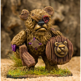 he Battle Bear by Northumbrian Tin Solider is a metal miniature of a teddy bear holding a sword in one hand and a shield in the other, with a button for one eye and a patch on his chest 