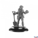 Zara Arkos Jumper Reaper Bones USA miniature. This female miniature has a shovel in one hand and is looking into the eye sockets of the skull she is holding in the other hand. She has a Sci-Fi feel, bag and weapon on her belt with more weapons on her back and she has short hair