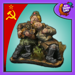 The Serenade is a metal mini diorama that comes in two pieces and is part of the Women of WW2 range by Bad Squiddo Games showing a musician serenading an adoring fan with a little picnic set up behind them.
