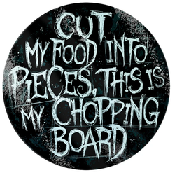 black glass chopping board with the words Cut My Food Into Pieces, This Is My Chopping Board in white writing