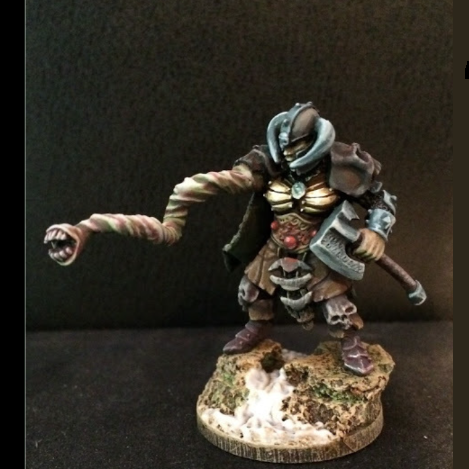 Adira Dark Champion by Bad Squiddo sculpted by Tim Prow. This very cool female warrior miniatures comes with options for assembly including a helmeted head or a ponytail head as well as the choice of tentacle arm or arm holding an axe to give you more freedom and detail on your gaming table.