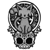 black white and grey Iron on patch, A pretty kitty sat on a skull with a symbolic wheel and pentagram behind