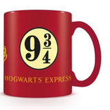 red mug with the words Hogwarts Express and nine and three quarters in a circle on the front and the back and the Hogwarts crest on the side. Harry Potter mug 