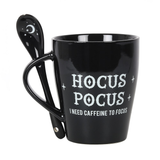 A lovely mug and spoon set in black, the mug has white writing saying Hocus Pocus I need caffeine to focus and the spoon has a crescent moon and stars motif.