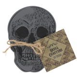 Skull Coaster Set , in this image you can see the string that ties them together and the tag