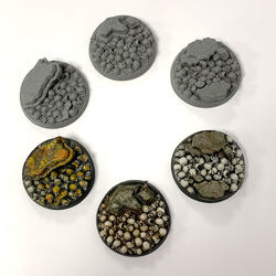 A pack of five resin 40mm bases adorned with skulls and rocks by Legend Games