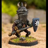 Sentinel Blade by Northumbrian Tin Solider from the Nightfolk sentinel range wears battered armour with a horned helmet, carries a shield with a sun sticking its tongue out on the front