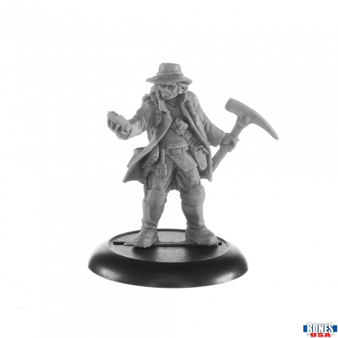  Rook, Arkos Jumper from the Bones USA range by Reaper Miniatures. A male archaeologist style character holding a pick axe in one hand and an object in the other