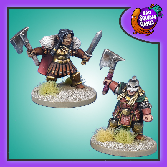 2 metal Minatures by Bad Squiddo Games depicting female dwarf champions, one with an axe raised above her head and the other with an axe in one hand and a sword in the other. Bad Squiddo Games