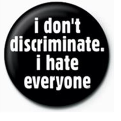 A black button pin badge with white 'I Don't Discriminate I Hate Everyone' writing. 