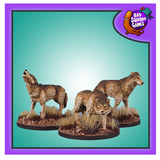 Metal gaming miniatures from Bad Squiddo Games. One wolf is standing with its head in a howling position, one is stood as if it has spotted its pray and the other has its head lower, snarling as if warning your adventuring party not to approach any closer.  