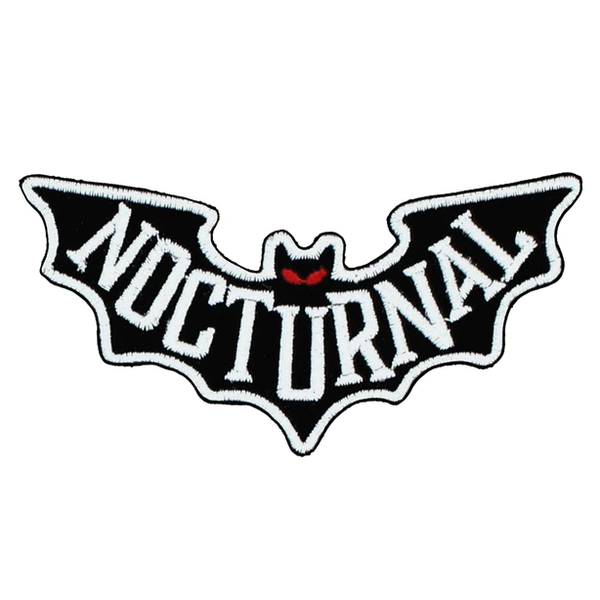 A wonderfully alternative iron on patch. This bat shaped cotton patch has red eyes and the word Nocturnal across it in white letters.