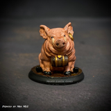 Reaper miniatures grog hog sat on its bottom with a keg around its neck and maybe even the faintest hint of a cheeky smile. 