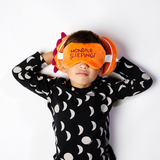 child wearing Orange Monster Travel Pillow & Eye Mask