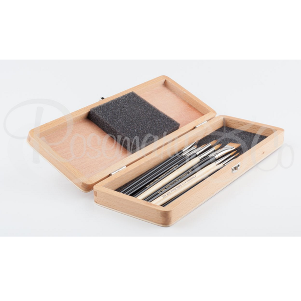 light coloured wooden art box open with brushes inside