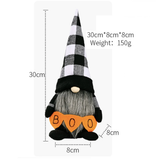 Halloween Gonk. black and white check tall hat, grey beard and holding an orange banner that says Boo.
