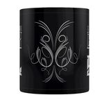 A black mug featuring a flourish design  in white