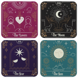 Tarot Card Coaster Set showing modern illustration of classic cards; The Star (purple), The Sun (teal), The Moon (black) and The Lovers (burgundy)