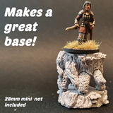 The Stump Tortoise by Bad Squiddo Games is sculpted by Ristul and can be used in many ways on your gaming table from a platform to hold your most prized dice to a forest spirit to a ride for your RPG party. With an adorable face, tortoise legs and tree stump body. shown here with a human miniature riding on top 