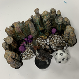 skull cavern feature by Legend Games. A resin feature depicting rocky formations, layers, height changes, skull covered floor and crystal formations shown with dice