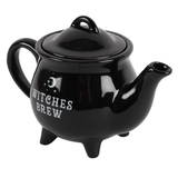 ceramic black cauldron shaped tea pot has the words Witches Brew in white on the side